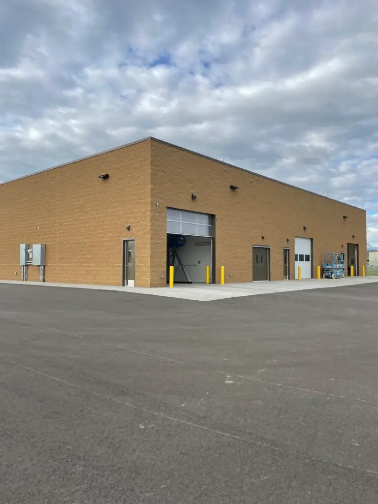 Post construction exterior of the Yellowstone Regional Airport Car Wash Quick Turnaround Facility showcasing the structural masonry exterior completed by Groathouse Construction